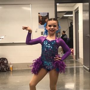 Weissman people and turquoise blue dance costume